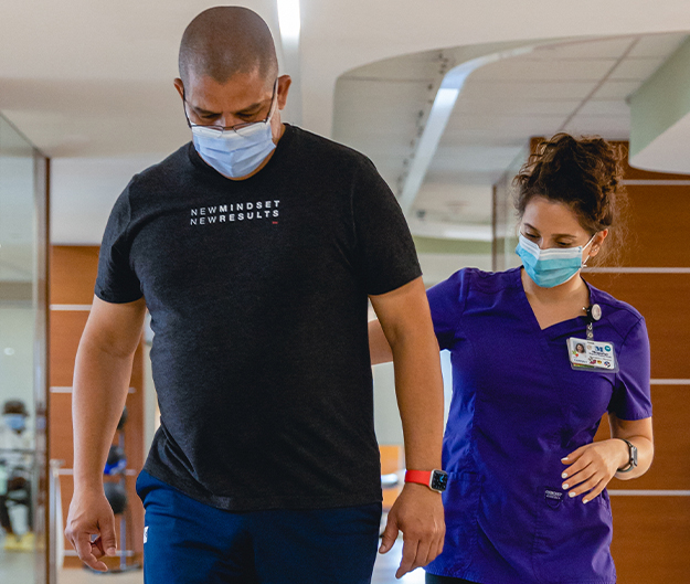 Juan, who had a stroke, with Hannah, his therapist at Memorial Rehabilitation Institute